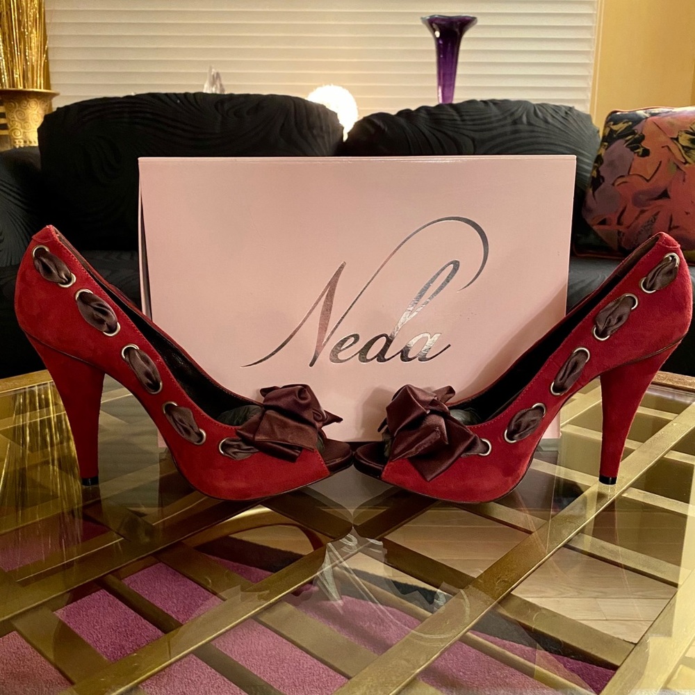 Red bow peep toe pumps; Italian made.